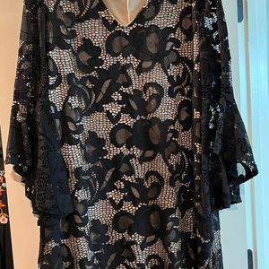 Beautiful lace dress lined with bell sleeves. Worn once.